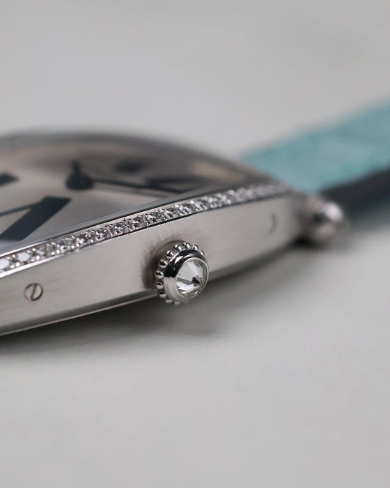 Close-up detail of the Cartier Tonneau WE400731 crown and diamond-set white gold case.