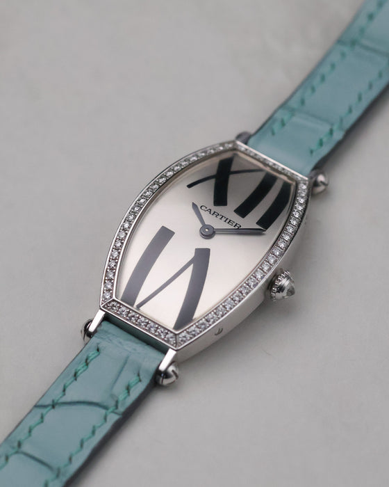 Three-quarter view of the Cartier Tonneau WE400731 with oversized Roman numerals and curved tonneau case.