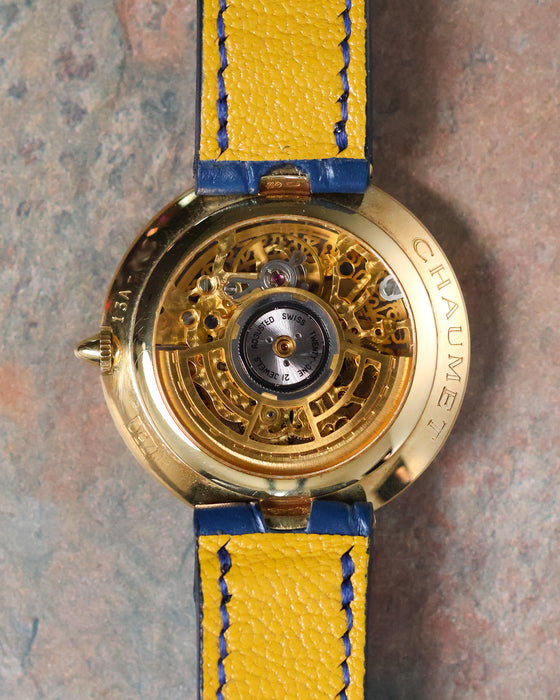 Rear view of the Chaumet Pebble 13A showing the open case back and automatic rotor.
