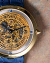 Macro detail of the Chaumet Pebble 13A skeletonised date wheel and blue Roman numeral chapter ring.