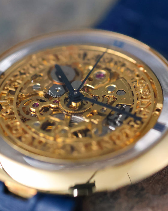 Close-up of the Chaumet Pebble 13A skeletonised dial highlighting the exposed movement and date display.