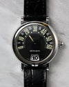 Front view of the Gerald Genta Retro Classic G.3614 with black dial, retrograde minute display and jumping hour aperture.