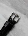 Original steel Gerald Genta buckle attached to the black leather strap of the G.3614.