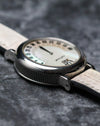 Side profile of the Gerald Genta G.3614 steel case showing the fluted mid-case and mother of pearl dial.
