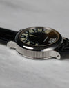 Low angled view of the Gerald Genta Retro Classic G.3614 black dial with retrograde display and polished steel case.