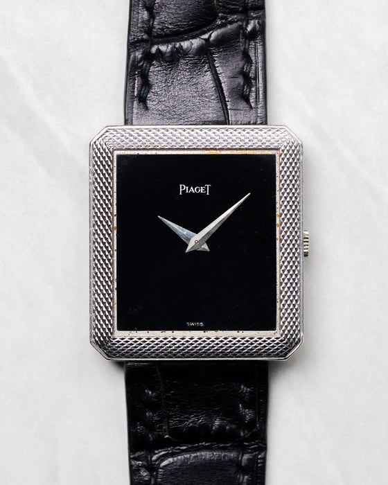 Piaget Protocole Ref. 91546 with black onyx dial and Clous de Paris engraved white gold case shown from the front.