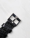 Original Piaget white gold pin buckle fitted to a black leather strap.