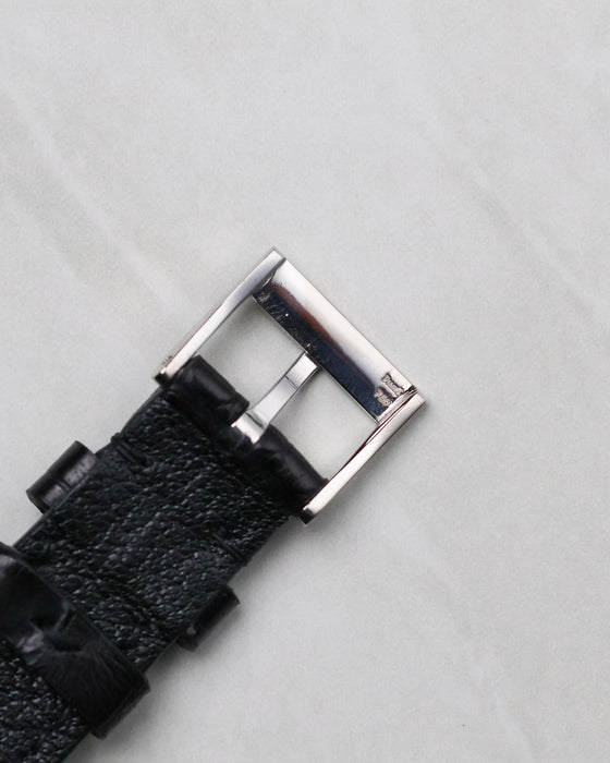 Reverse view of the Piaget signed 18k white gold buckle attached to the strap.