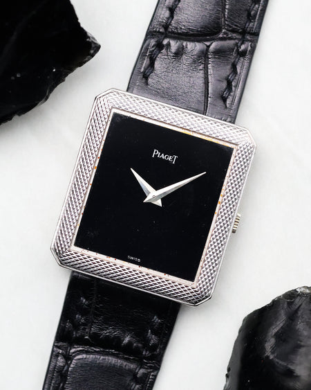 Angled view of the Piaget Protocole Ref. 91546 highlighting the black onyx dial and textured bezel.