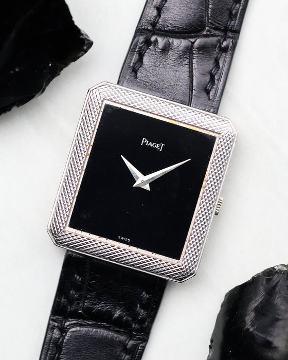 Angled view of the Piaget Protocole Ref. 91546 highlighting the black onyx dial and textured bezel.