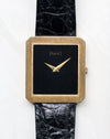 Piaget Protocole Ref. 8154 with black onyx tapestry dial and ribbed 18k yellow gold case photographed from the front.