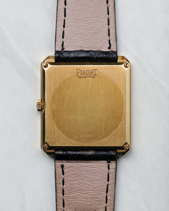 Caseback view of the Piaget Protocole Ref. 8154 showing the solid 18k yellow gold back and reference engraving.