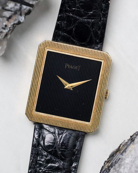 Angled view of the Piaget Protocole Ref. 8154 highlighting the hand-carved onyx dial and ribbed bezel.