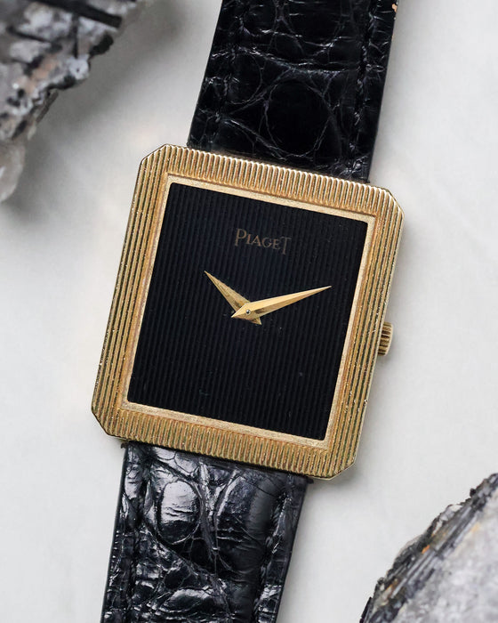 Angled view of the Piaget Protocole Ref. 8154 highlighting the hand-carved onyx dial and ribbed bezel.