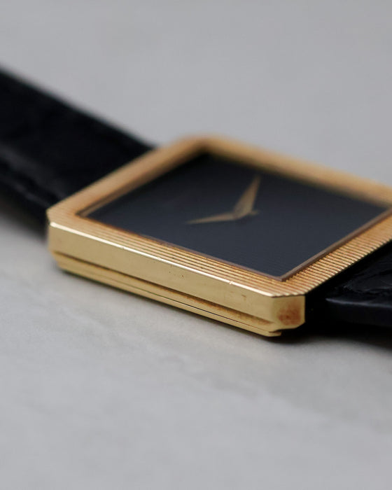 Low-angle profile of the Piaget Protocole Ref. 8154 showing the stepped case side and thin proportions.