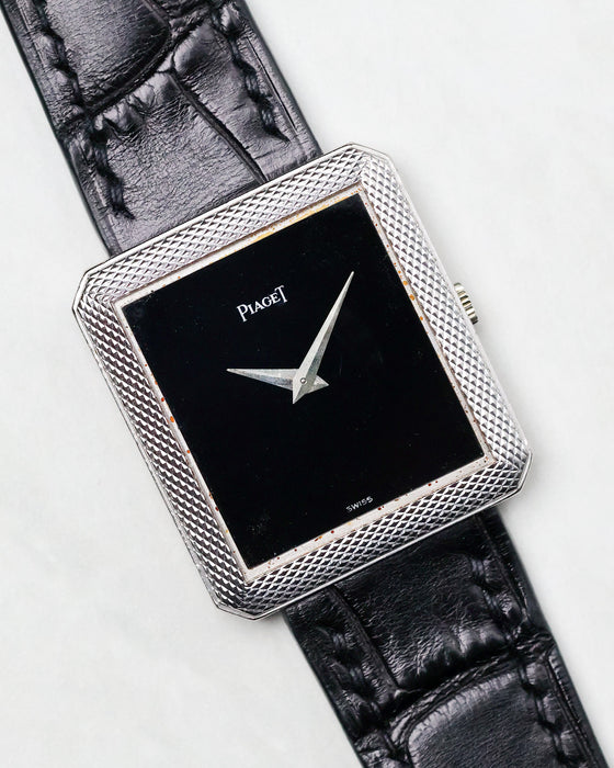 Front view of the Piaget Protocole Ref. 91546 with black onyx dial and white gold case on leather strap.