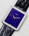 Angled close-up of the Piaget Protocole Ref. 9154 lapis dial and ribbed bezel details.