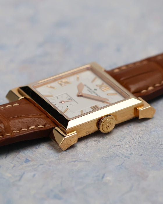 Side profile of the Vacheron Constantin Carré Historiques Ref. 91030 yellow gold case and signed crown.