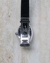 Rear view of the Cartier Baignoire Biplan ref. 2295 showing the integrated hinged opening mechanism in the white gold case.