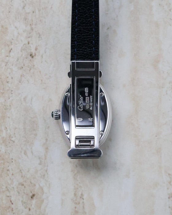 Rear view of the Cartier Baignoire Biplan ref. 2295 showing the integrated hinged opening mechanism in the white gold case.