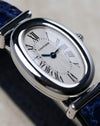 Cartier Baignoire Biplan ref. 2295 in white gold with guilloché dial shown in close-up front angle view.