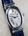 Close-up of the Cartier Baignoire Biplan ref. 2295 displaying the oval dial and polished white gold case.