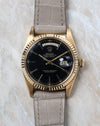 Front view of the Rolex Day-Date 1803 with black lacquer dial, yellow gold case and day-date display.
