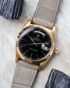 Angled view of the Rolex Day-Date 1803 highlighting the black lacquer dial and fluted bezel.