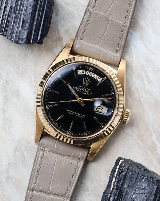 Angled view of the Rolex Day-Date 1803 highlighting the black lacquer dial and fluted bezel.