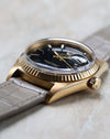 Side profile of the Rolex Day-Date 1803 showing the domed crystal, cyclops magnifier and yellow gold case.