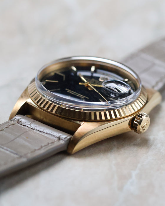 Side profile of the Rolex Day-Date 1803 showing the domed crystal, cyclops magnifier and yellow gold case.