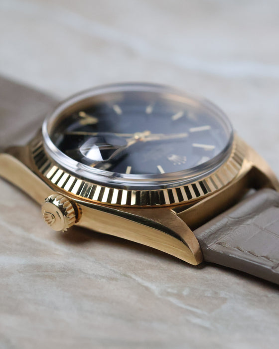 Side profile of the Rolex Day-Date 1803 showing the signed crown and sharp lug profile.