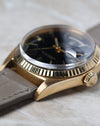 Opposite side profile of the Rolex Day-Date 1803 highlighting the fluted bezel and case shape.