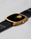 Low-angle profile of the Piaget Ref. 9591 highlighting the sculpted gold case and crown.