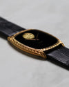 Angled side view of the Piaget Ref. 9591 showing the engraved tonneau case and black onyx dial.