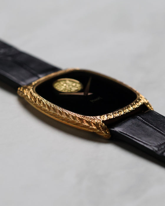 Angled side view of the Piaget Ref. 9591 showing the engraved tonneau case and black onyx dial.
