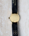Patek Philippe Ref. 3017 yellow gold ladies watch showing the brushed caseback and signed strap.