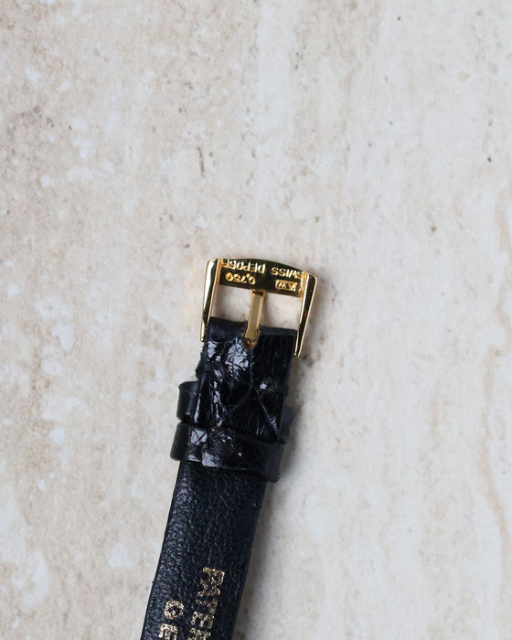Original 18k yellow gold Patek Philippe buckle attached to the signed strap of the Ref. 3017.