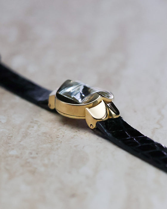 Three-quarter profile of the Patek Philippe Ref. 3017 showing the signed crown and crystal.