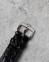 Original 18K white gold Rolex tang buckle fitted to the black leather strap.