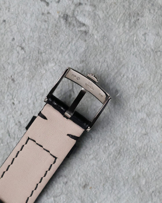 Reverse view of the original Rolex 18K white gold tang buckle with hallmarks visible.