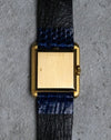 Solid 18K gold caseback of the vintage Girard-Perregaux rectangular manual-wind watch.