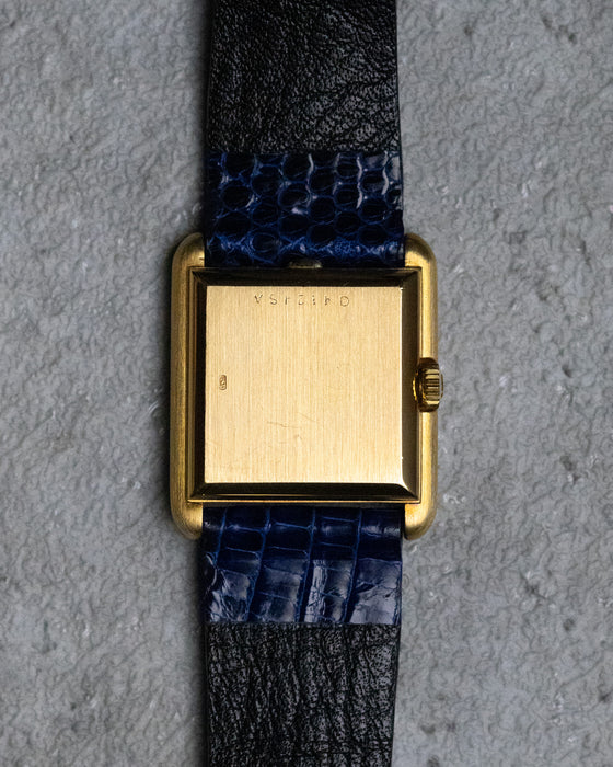 Solid 18K gold caseback of the vintage Girard-Perregaux rectangular manual-wind watch.