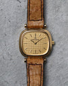 Jaeger-LeCoultre Ref. 6143.31 in 18K yellow gold with textured gold dial and brown leather strap.