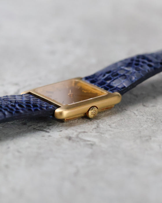 Side profile of the vintage Girard-Perregaux showing its slim gold case and signed GP crown.