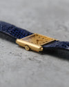 Angled view of the Girard-Perregaux showing its gilt dial, applied baton indexes and rectangular case.