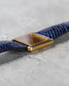 Low-angle view highlighting the unusual rounded horizontal case architecture of the Girard-Perregaux.