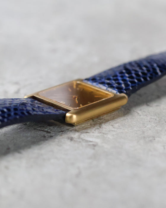 Low-angle view highlighting the unusual rounded horizontal case architecture of the Girard-Perregaux.