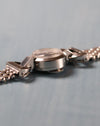 Side view of the Jaeger-LeCoultre back-wind watch showing the rear crown positioned beneath the case.
