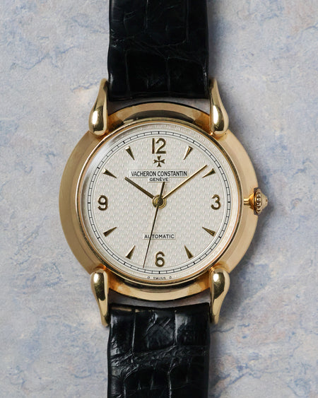 Front view of the Vacheron Constantin Historiques 48003 with engine-turned silver dial and applied gold markers.